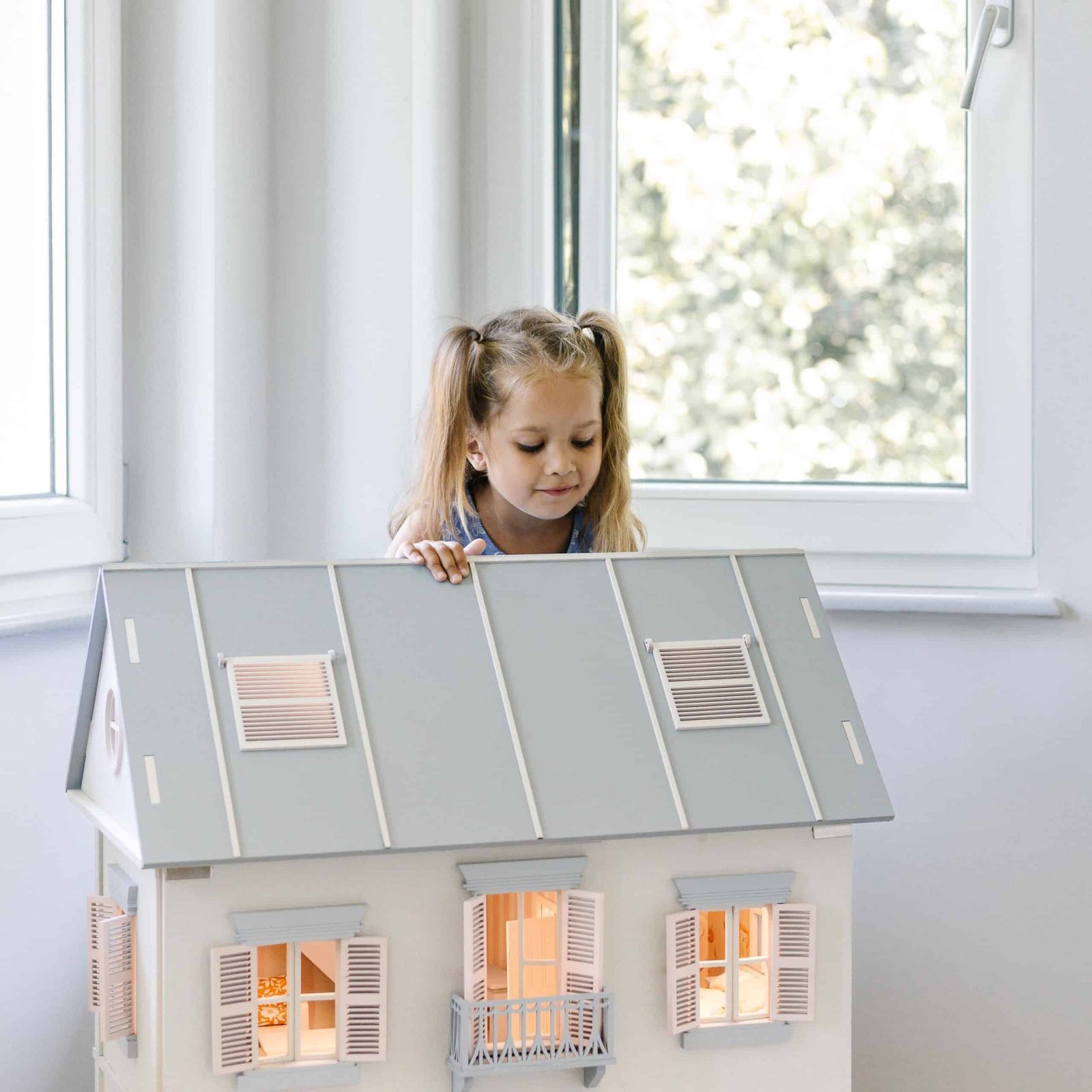 The Cognitive and Social Benefits of Dollhouse Play for Children 2 456188181 895126382666336 6917920786811466594 n scaled