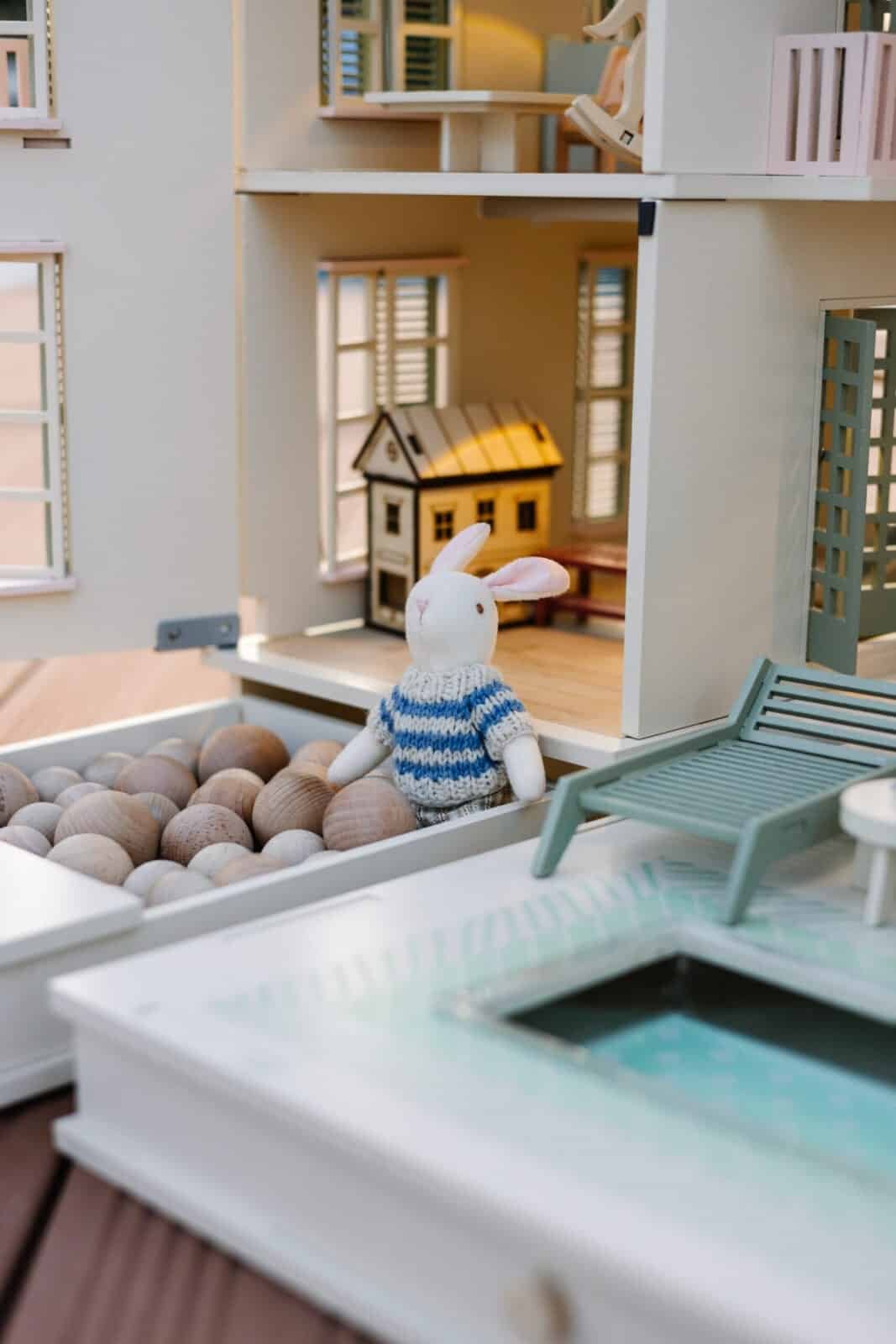 Luxury Wooden Dollhouse with Handcrafted Miniatures – Little Forest Animals Handcrafted wooden dollhouse with miniature furniture and details, displayed in a minimal setting.