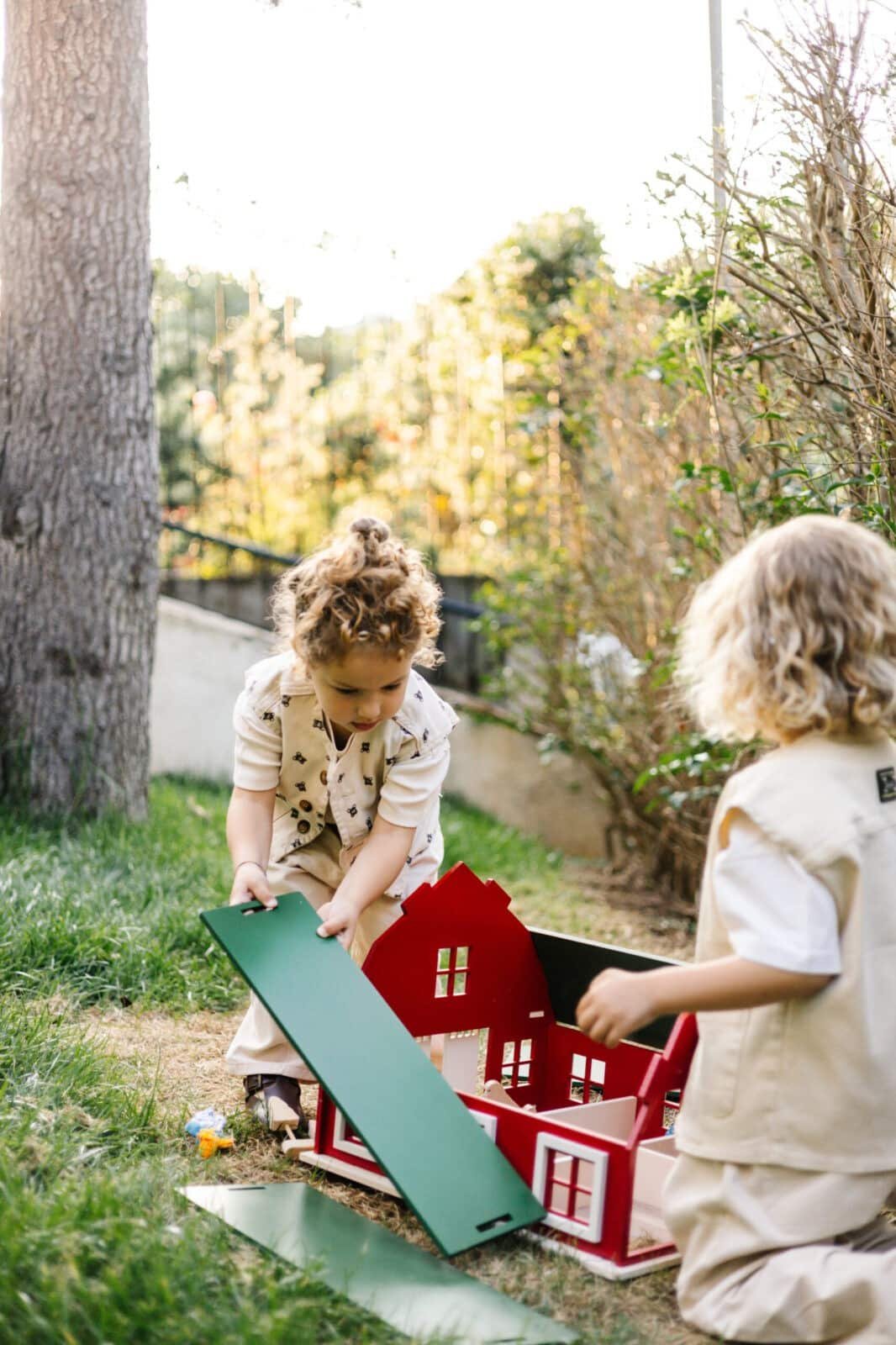 Handcrafted Barn-Style Wooden Dollhouse | Little Forest Animals Handcrafted red wooden barn-style dollhouse with green roof, designed by Little Forest Animals for sustainable and imaginative play.