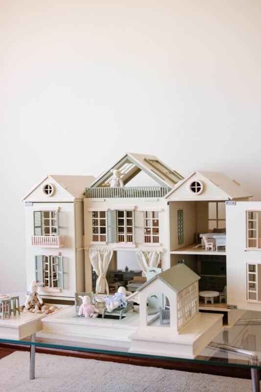 Little Forest Animals 9 Handcrafted wooden dollhouse with miniature furniture and details, displayed in a minimal setting.