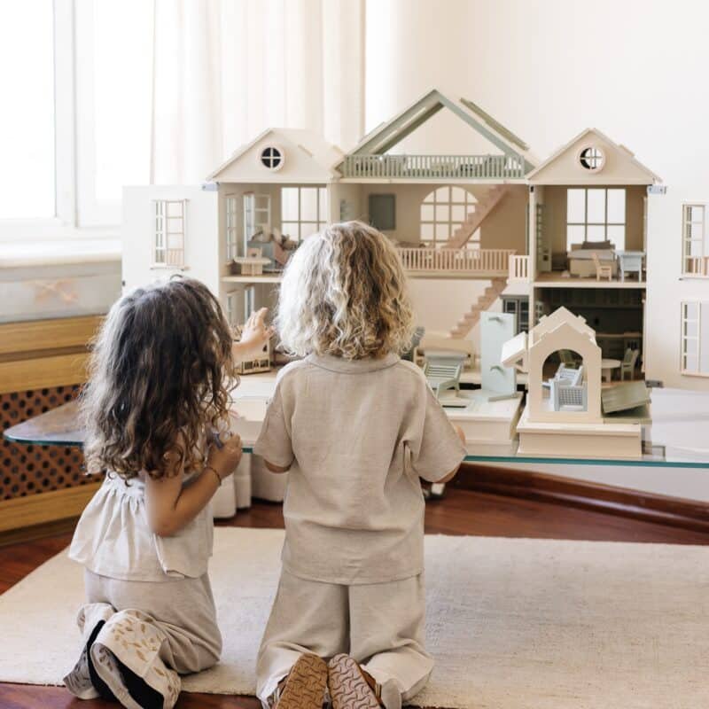Little Forest Animals 8 Handcrafted wooden dollhouse with miniature furniture and details, displayed in a minimal setting.